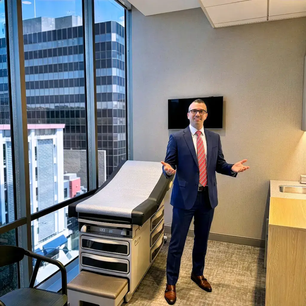 Dr. Achillefs Ntranos welcoming patients to the office