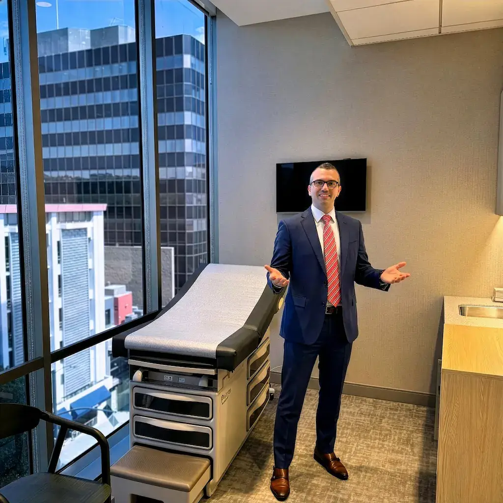 Dr. Achillefs Ntranos welcoming patient in the office